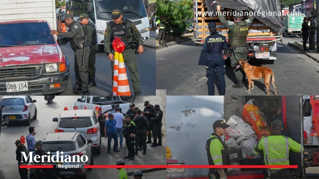 Policías revisan vehículos y camiones con apoyo canino en los accesos a Cali, en operativos de control para fortalecer la inteligencia en la ciudad.