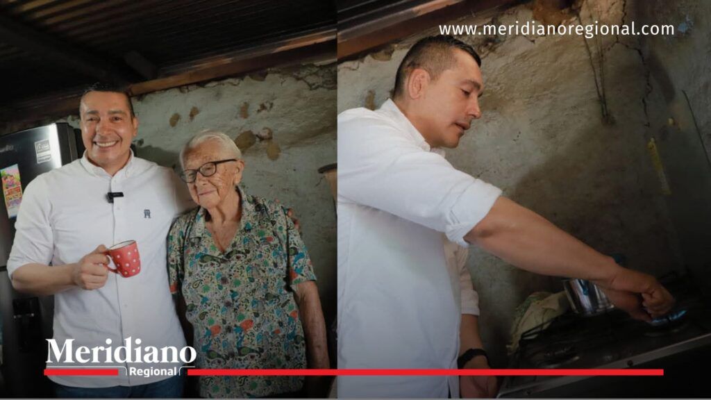 Octavio Guzmán encendiendo estufa con gas domiciliario en La Sierra Cauca junto a una adulta mayor.