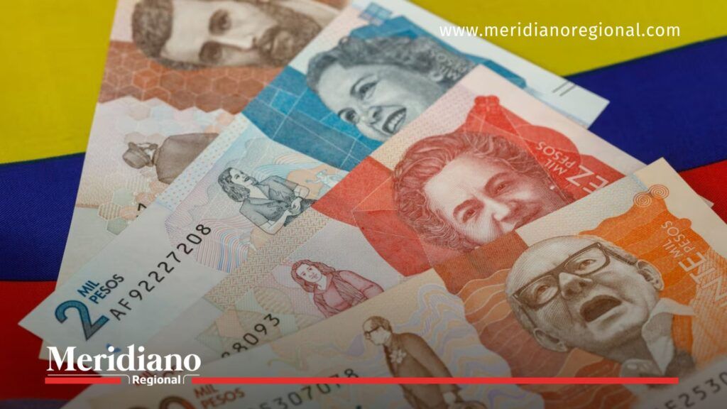 Transferencia de Renta Joven en billetes colombianos - Meridiano Regional Billetes de pesos colombianos sobre una superficie, imagen ilustrativa de los pagos de Renta Joven.