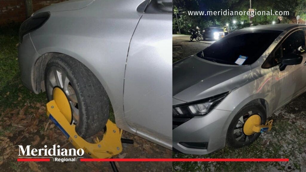 Cefo instalado en rueda de vehículo mal estacionado en Cali durante operativo de tránsito 2026.
