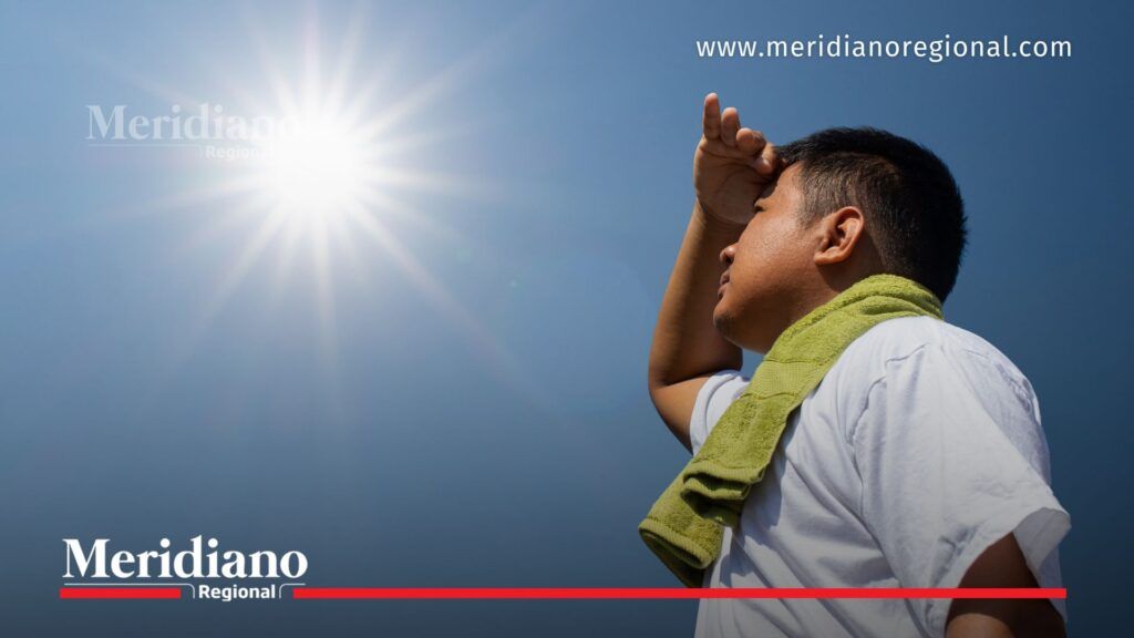 Pacífico colombiano enfrenta altas temperaturas por El Niño - Meridiano Regional Hombre se protege del fuerte sol durante una ola de calor. Imagen relacionada con las alertas por altas temperaturas y posible fenómeno del Niño en el Pacífico colombiano.