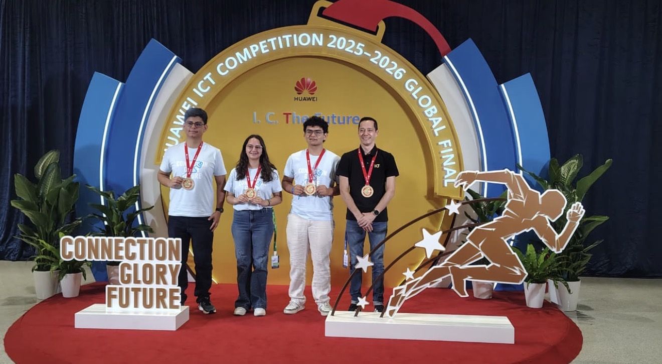 Four finalists pose with medals on a red carpet stage in front of a large gold circular backdrop and a 'Connection Glory Future' sign on the left side trap.